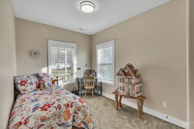 bedroom with carpet, visible vents, and baseboards