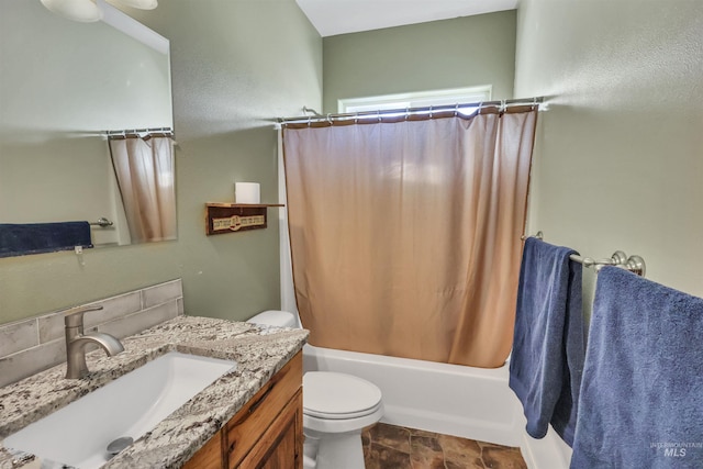 full bathroom with shower / tub combo with curtain, vanity, and toilet