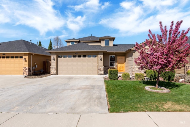 5359 N Landon Creek Pl, Meridian, ID 83646 - prairie-style home featuring a front lawn, driveway, stone siding, a garage, and roof with shingles