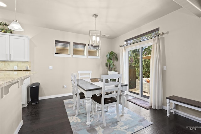 5359 N Landon Creek Pl, Meridian, ID 83646 - dining room with baseboards, a chandelier, and dark wood-style floors