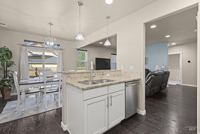 5359 N Landon Creek Pl, Meridian, ID 83646 - kitchen featuring stainless steel dishwasher, white cabinetry, dark wood-type flooring, and light stone counters