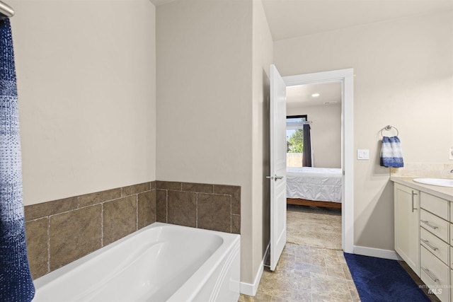 5359 N Landon Creek Pl, Meridian, ID 83646 - ensuite bathroom with ensuite bath, a garden tub, vanity, and baseboards