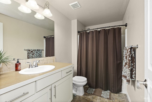 5359 N Landon Creek Pl, Meridian, ID 83646 - bathroom featuring toilet, visible vents, stone finish floor, curtained shower, and vanity