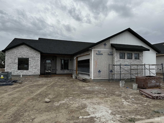 941 Gregory Way, Twin Falls, ID 83301 - property under construction with stone siding, an attached garage, and central AC