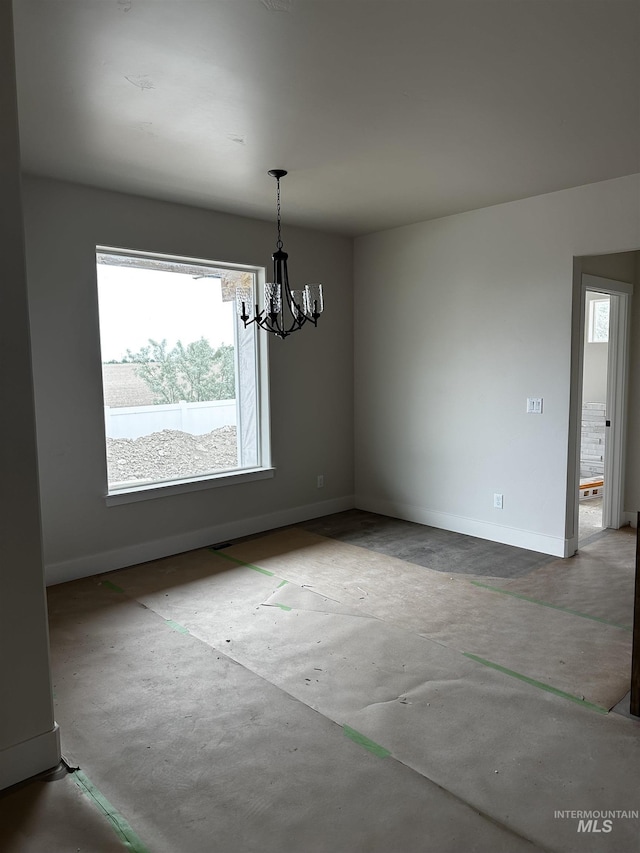 941 Gregory Way, Twin Falls, ID 83301 - unfurnished dining area with a chandelier and baseboards