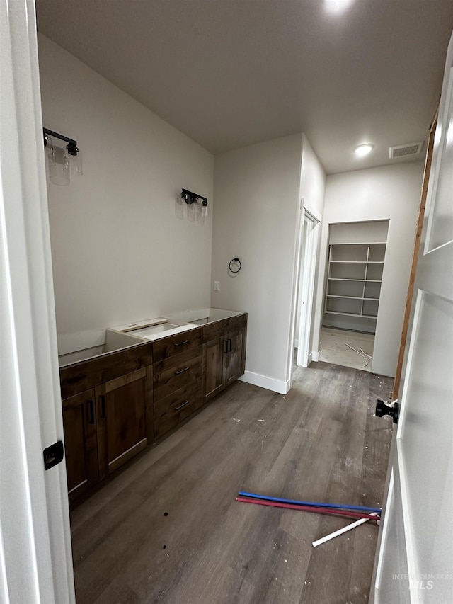 941 Gregory Way, Twin Falls, ID 83301 - bathroom featuring wood finished floors, double vanity, and a spacious closet