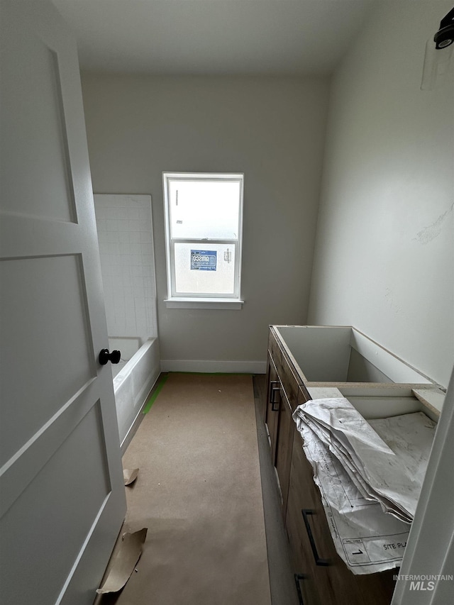 941 Gregory Way, Twin Falls, ID 83301 - bathroom featuring vanity, a bath, and baseboards