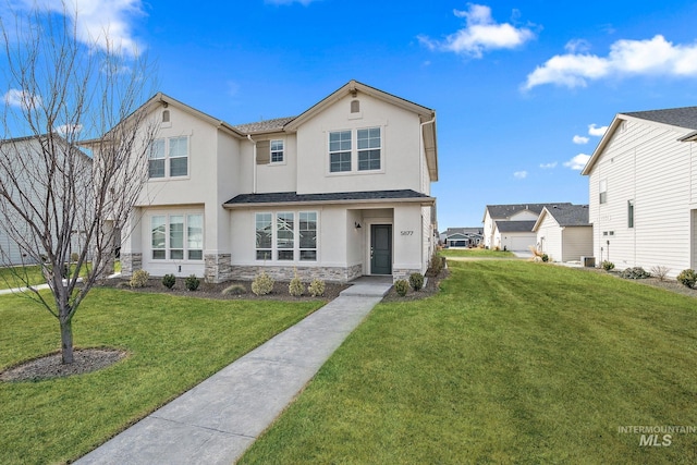 view of front facade featuring stone siding, a front lawn, and stucco siding