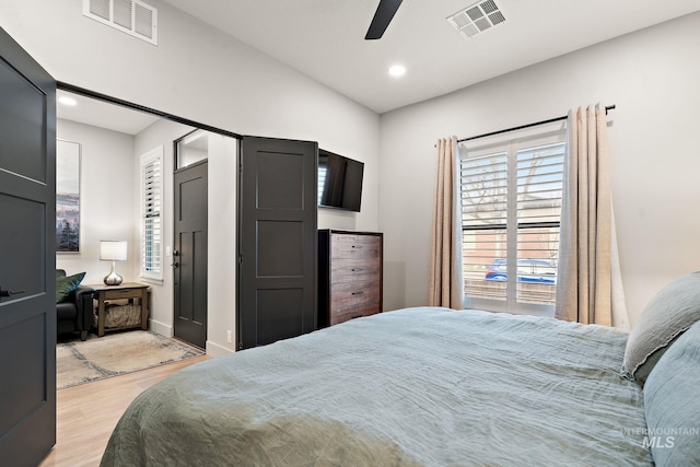 bedroom with a ceiling fan, light wood-type flooring, visible vents, and recessed lighting