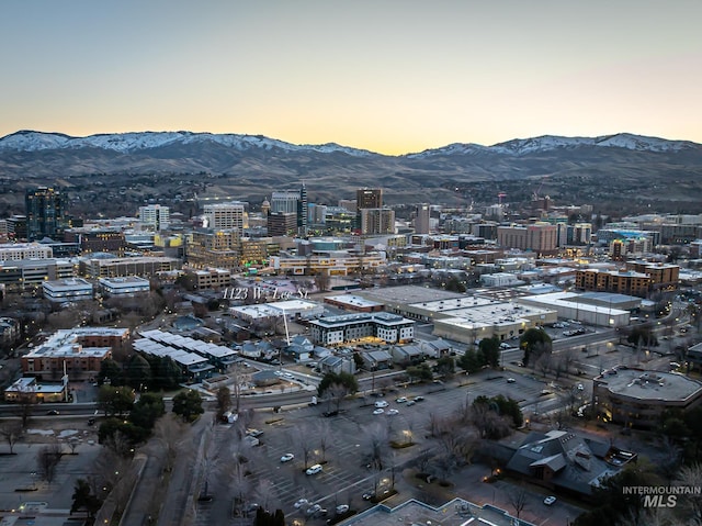 property's view of city with a mountain view