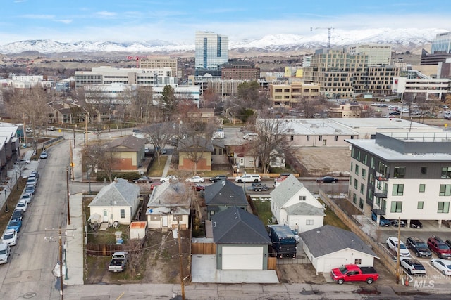 birds eye view of property with a city view and a mountain view