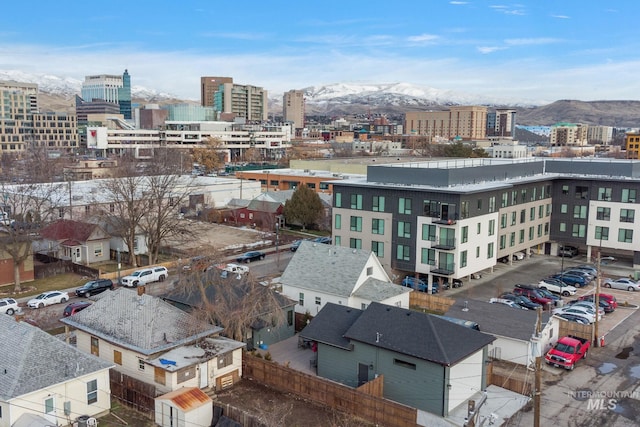 property's view of city featuring a mountain view