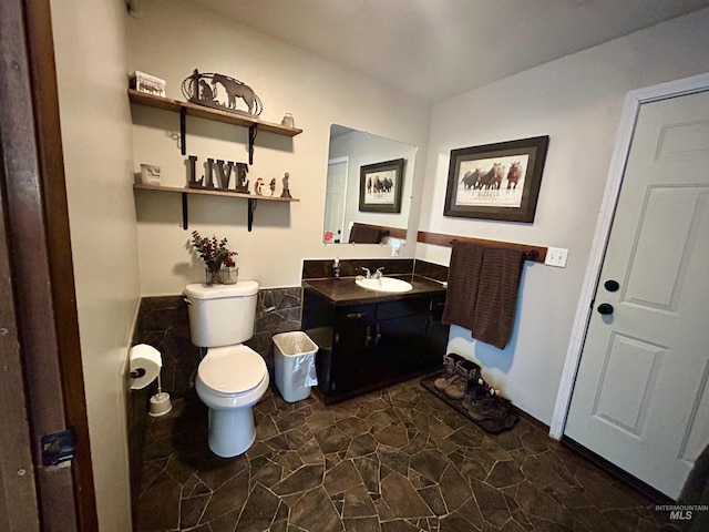 170 Red Fir, Kooskia, ID 83539 - bathroom featuring vanity, stone finish floor, and toilet