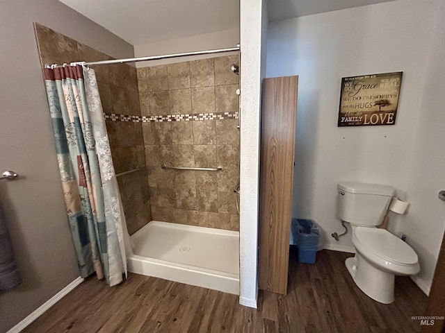 170 Red Fir, Kooskia, ID 83539 - bathroom featuring baseboards, tiled shower, and wood finished floors