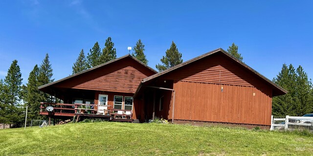 170 Red Fir, Kooskia, ID 83539 - back of house featuring a lawn and a deck