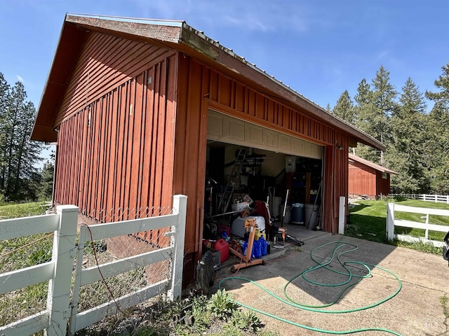 170 Red Fir, Kooskia, ID 83539 - view of home's exterior featuring board and batten siding, fence, an outdoor structure, and a garage
