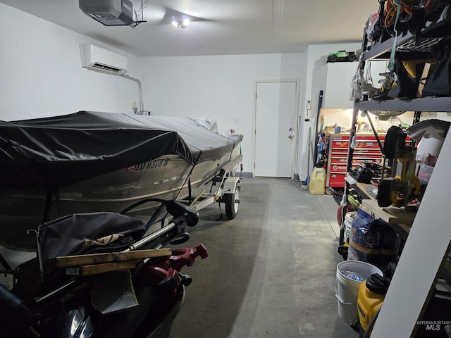 garage with a garage door opener and a wall unit AC