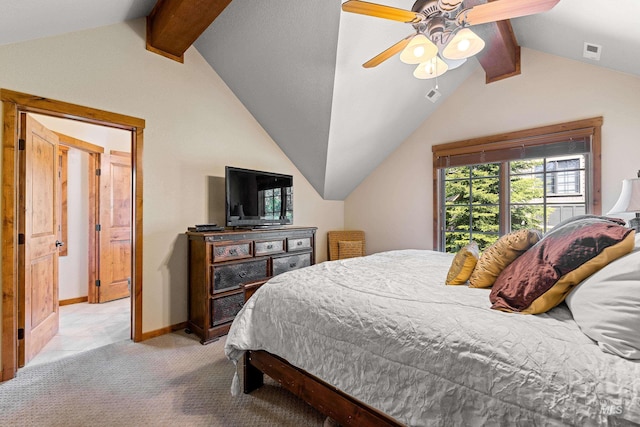 carpeted bedroom with vaulted ceiling with beams and ceiling fan