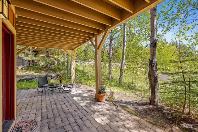 view of patio with an outdoor fire pit