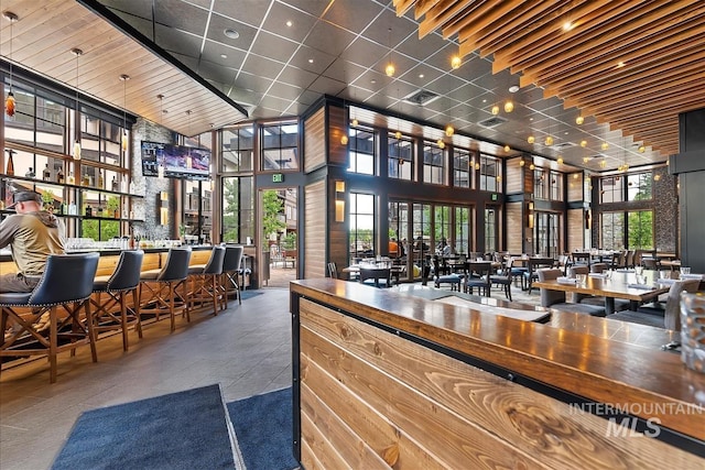 interior space featuring a high ceiling and a wealth of natural light