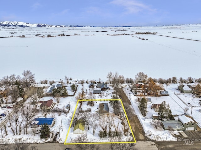 snowy aerial view featuring a residential view