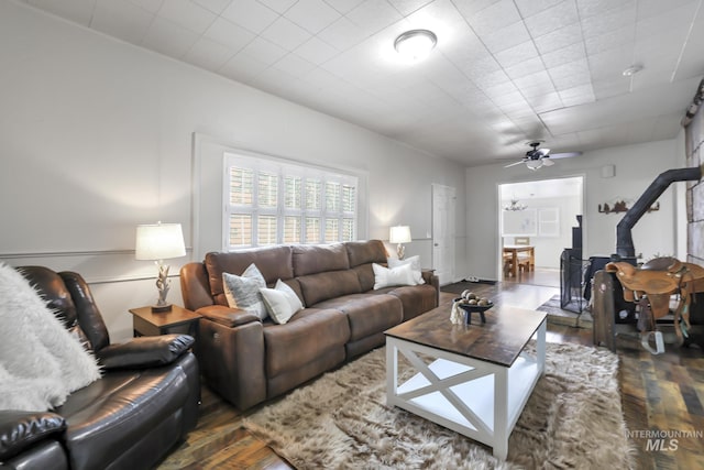 living area featuring ceiling fan and wood finished floors