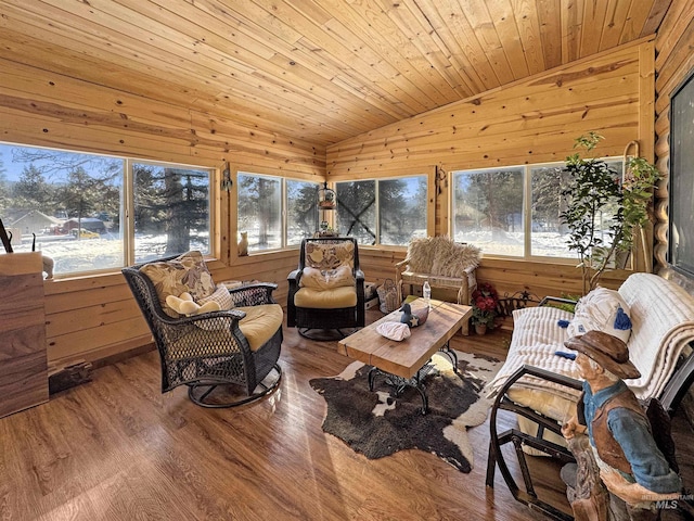 sunroom / solarium with a healthy amount of sunlight, vaulted ceiling, and wooden ceiling