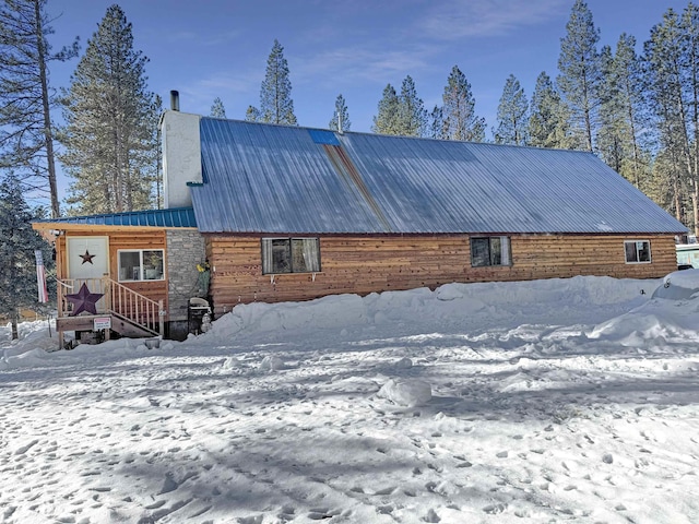 view of snow covered house