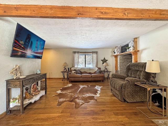 living room featuring a textured ceiling and hardwood / wood-style flooring