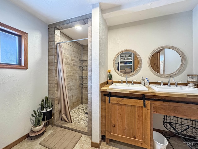 bathroom with walk in shower and vanity