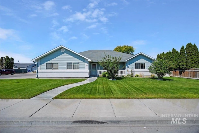 ranch-style home with a front lawn