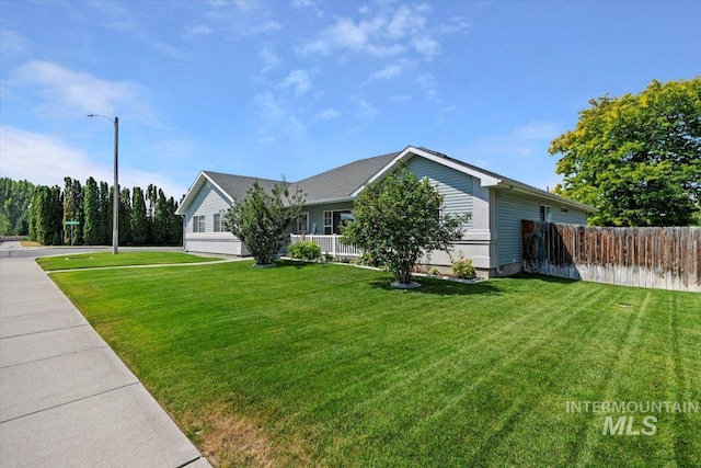 view of home's exterior with a yard