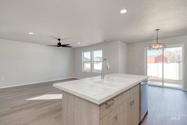 1468 N Coltsfoot Ave, Kuna, ID 83634 - kitchen with a sink, light brown cabinetry, light wood-type flooring, dishwasher, and light countertops