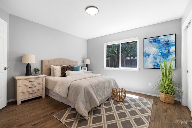 11031 W Red Maple Dr, Boise, ID 83709 - bedroom with dark wood-type flooring and baseboards