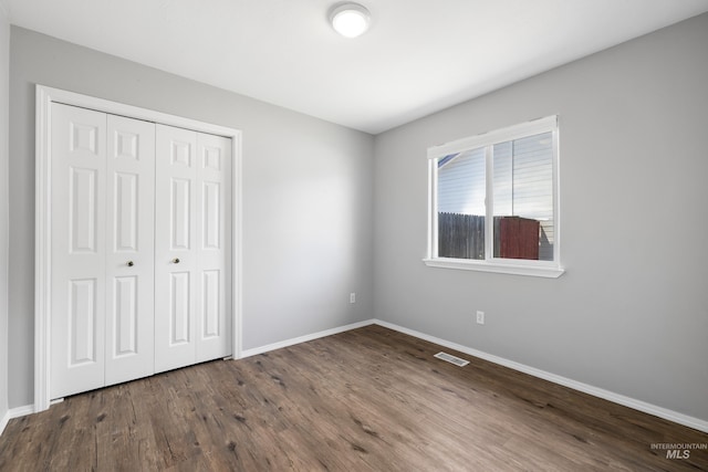11031 W Red Maple Dr, Boise, ID 83709 - unfurnished bedroom with wood finished floors and a closet