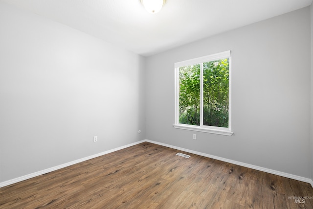 11031 W Red Maple Dr, Boise, ID 83709 - spare room featuring baseboards and hardwood / wood-style floors