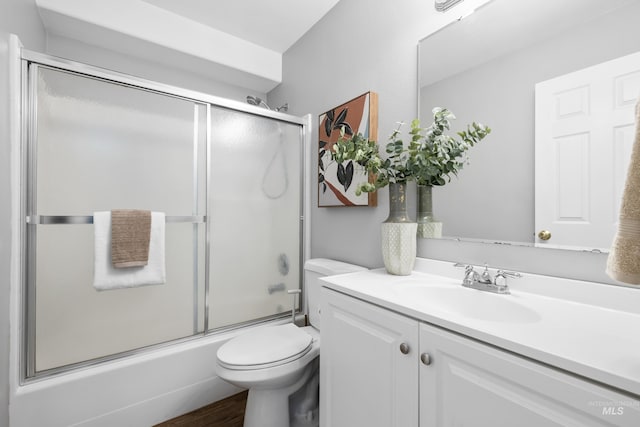 11031 W Red Maple Dr, Boise, ID 83709 - full bathroom with vanity, shower / bath combination with glass door, and wood finished floors