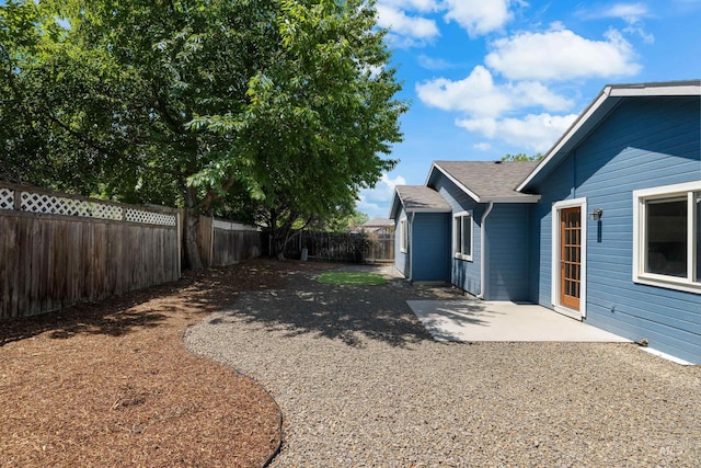 11031 W Red Maple Dr, Boise, ID 83709 - fenced backyard with a patio area
