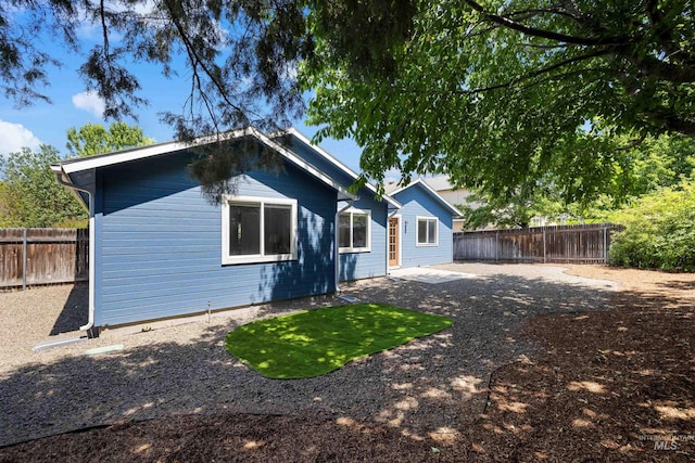 11031 W Red Maple Dr, Boise, ID 83709 - rear view of house featuring a fenced backyard and a patio area