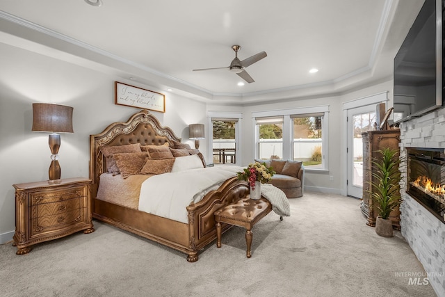 3136 S Bear Claw Way, Meridian, ID 83642 - bedroom featuring access to exterior, carpet floors, a raised ceiling, a glass covered fireplace, and ornamental molding