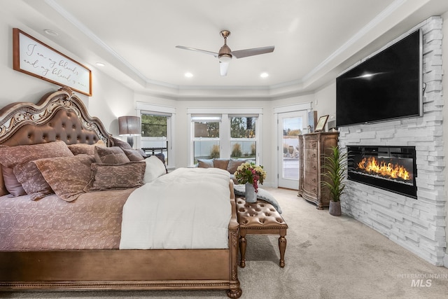 3136 S Bear Claw Way, Meridian, ID 83642 - carpeted bedroom featuring a fireplace, access to exterior, a tray ceiling, ornamental molding, and ceiling fan