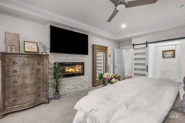 3136 S Bear Claw Way, Meridian, ID 83642 - carpeted bedroom featuring a barn door, crown molding, a fireplace, ceiling fan, and recessed lighting
