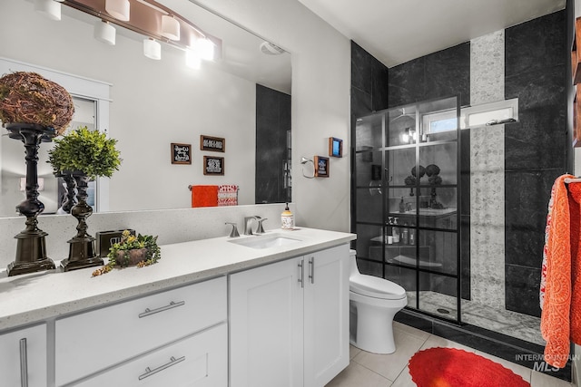 3136 S Bear Claw Way, Meridian, ID 83642 - full bath featuring toilet, tile patterned floors, vanity, and a shower stall