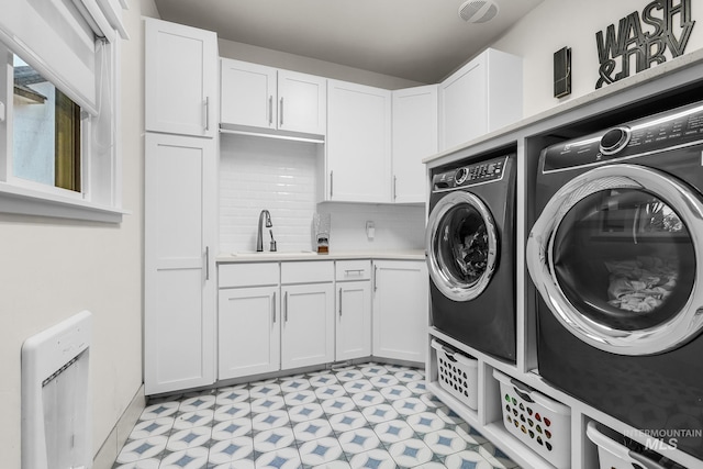 3136 S Bear Claw Way, Meridian, ID 83642 - laundry area featuring separate washer and dryer, light floors, cabinet space, and baseboards