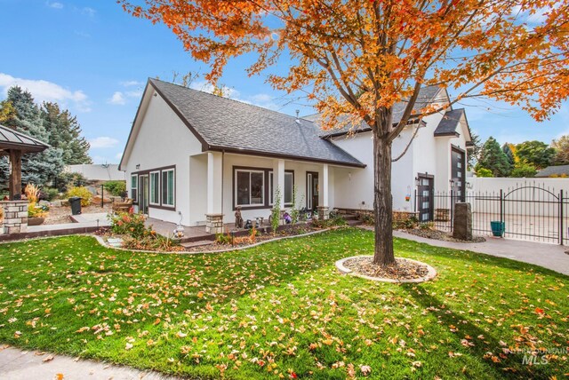 3136 S Bear Claw Way, Meridian, ID 83642 - view of front facade featuring stucco siding, a gazebo, a gate, and a shingled roof