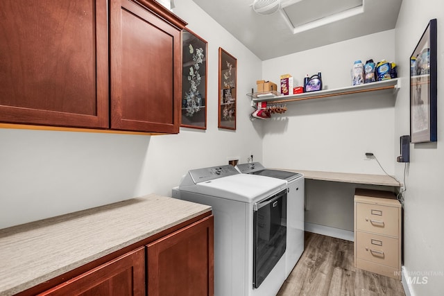 3136 S Bear Claw Way, Meridian, ID 83642 - laundry room featuring washer and clothes dryer, cabinet space, light wood-style floors, and attic access