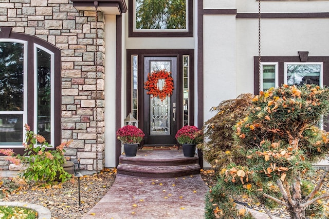3136 S Bear Claw Way, Meridian, ID 83642 - view of exterior entry featuring stone siding and stucco siding