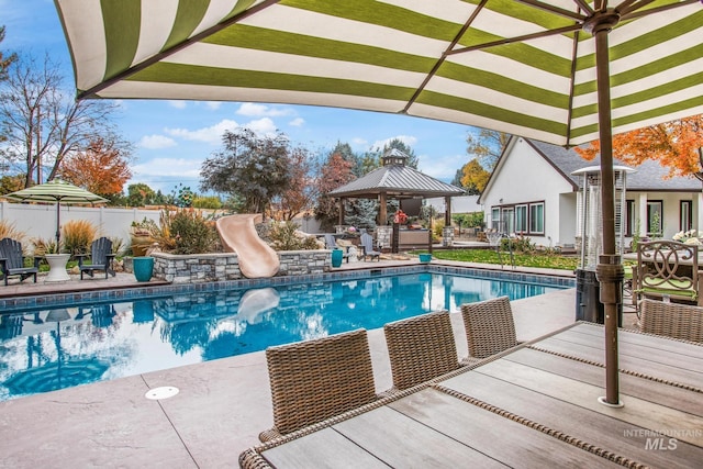 3136 S Bear Claw Way, Meridian, ID 83642 - view of pool with a gazebo, a water slide, a patio area, and a fenced backyard