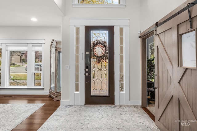 3136 S Bear Claw Way, Meridian, ID 83642 - foyer entrance with a barn door and dark wood finished floors