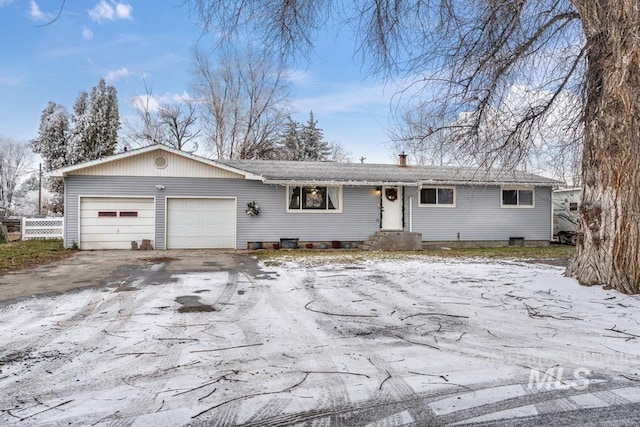 112 W California, Homedale, ID 83628 - ranch-style house featuring driveway, an attached garage, fence, and a chimney